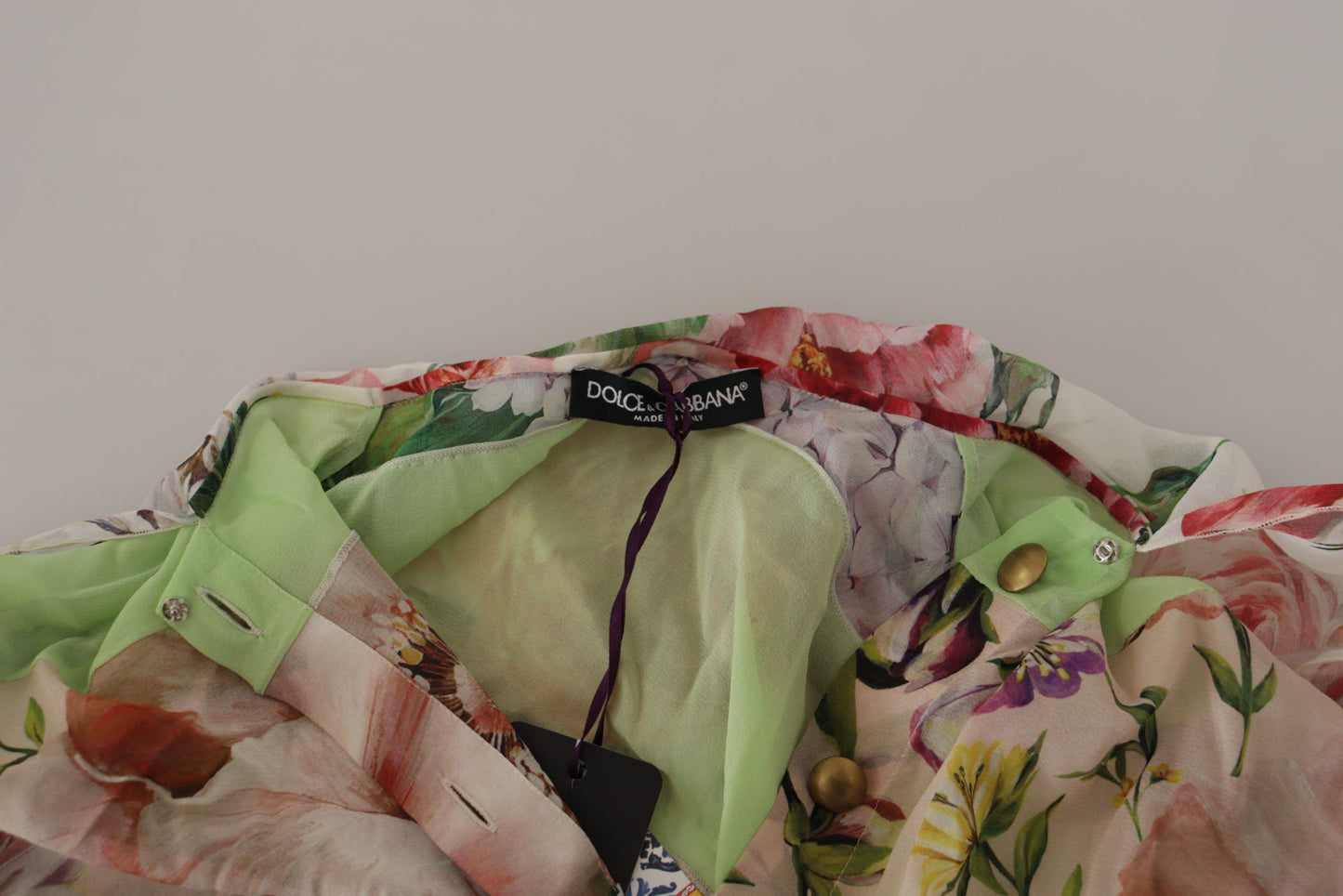 بلوزة دولتشي آند غابانا متعددة الألوان بتصميم مرقع من الزهور بياقة أسكوت