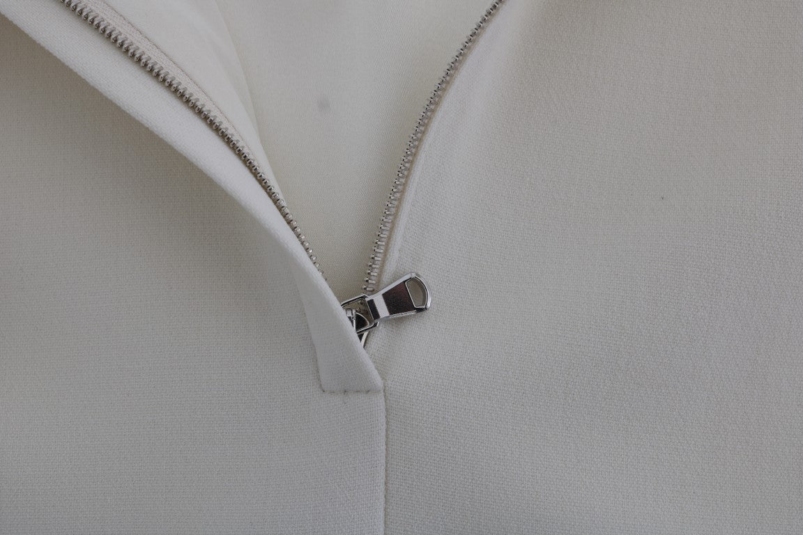 فستان دولتشي آند غابانا من الصوف الأبيض القابل للتمدد بروش