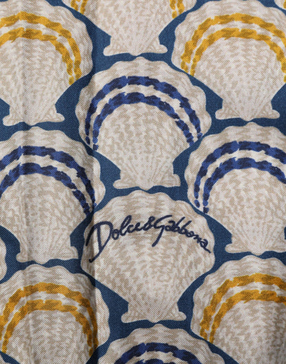قميص دولتشي آند غابانا كريمي من القطن والحرير بطبعة صدفة هاواي