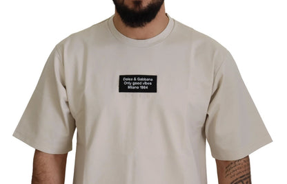 قميص دولتشي آند غابانا عاجي قطني مطبوع برقبة دائرية